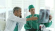 two doctors studying an x-ray