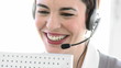 close-up of a cheeful woman on phone in a call center
