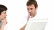 man and woman discussing sitting in front of computer