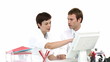 colleagues working together at a computer sitting in the office