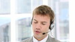 Vidéo : businessman using headset in his office businessman using headset in his office