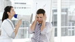 young woman discouraging her colleague using a megaphone