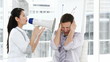 asian businesswoamn complaining using a megaphone