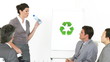 Beautiful businesswoman presenting the concept of recycling