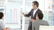 mature businessman presenting stats