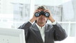 Video: Mature businessman looking through binoculars Mature businessman looking through binoculars