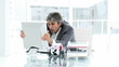 Disconsolate businessman working at a computer