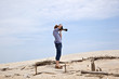 boy taking pictures at the beautiful beach