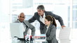 manager helping two employees