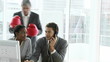 manager stimulating his two employees working at a computer