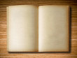 old book open on oak wood background old book open on oak wood background