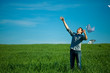 young man throwing a paper in the green field