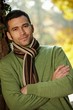 Portrait of handsome young man in autumn park