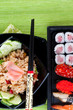 Sushi with chopsticks shot on green Sushi with chopsticks shot on green