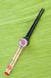 Sushi with chopsticks shot on green Sushi with chopsticks shot on green