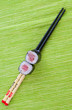 Sushi with chopsticks shot on green Sushi with chopsticks shot on green