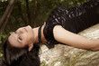 girl lying on the tree