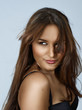 Beautiful brunette hispanic woman with long hair