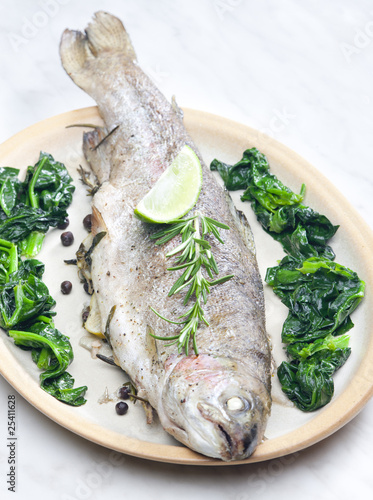 bream baked with Italian herbs and fried spinach bream baked with Italian herbs and fried spinach