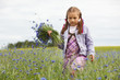 Little girl picking blue flowers Little girl picking blue flowers