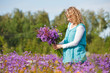 Women picking lilac flowers Women picking lilac flowers