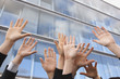 germany, hamburg, business people cheering, hands raised, close-up