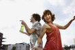 germany, berlin, young couple dancing, laughing, portrait