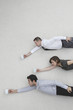 flying business people holding coffee mugs, side view
