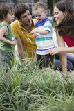 Photo : germany, berlin, parents looking at ladybird on childs (2-3) arm, laughing, portrait germany, berlin, parents looking at ladybird on childs (2-3) arm, laughing, portrait