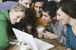 friends using laptop.