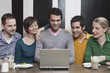 friends using laptop.