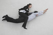 two businesss people, woman riding on man's back, side view, elevated view, portrait