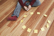 man sitting besides a circle of adhesive notes