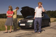 germany, bavaria, three friends with broken down car