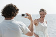 spain, mallorca, man taking a photograph of a woman