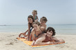 spain, mallorca, family lying on beach