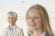 spain, mallorca, two businesswomen laughing, portrait