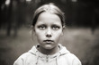 Black and white portrait of tired little girl with sad eyes. Black and white portrait of tired little girl with sad eyes.