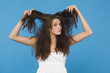 young woman tearing her hair, portrait