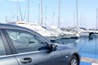 luxury car and yacht sailboats on Spain marina