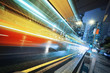 Long exposure shot of blurred bus speeding through night street Long exposure shot of blurred bus speeding through night street