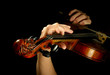 Musician playing violin isolated on black Musician playing violin isolated on black