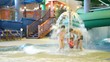 Charming woman and man drag girl in pool in water park Charming woman and man drag girl in pool in water park