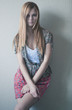 Young woman on wall background