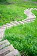 Downhill curving footpath made of wooden steops Downhill curving footpath made of wooden steops