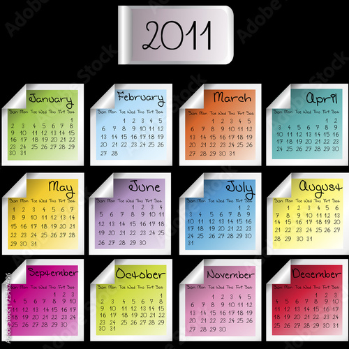 2011 calendar on colored sheets over black background