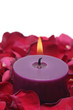 Romantic scented candles and rose petals