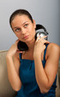 Young female sitting on the sofa with headphones