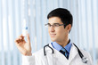 Happy doctor with drug, at office