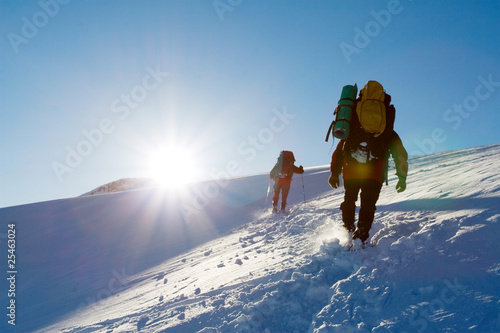 Photo: Hiker are in winter mountains Hiker are in winter mountains